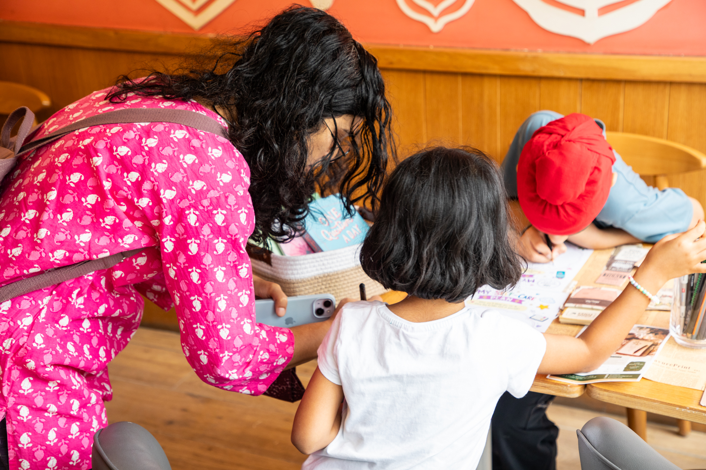 Family journaling together at a workshop